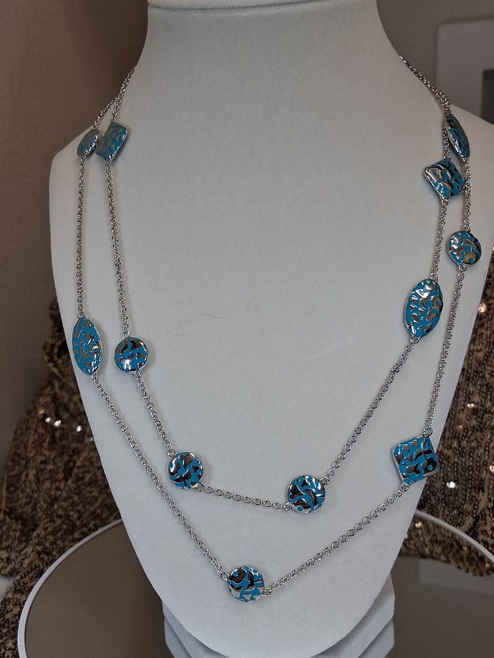 42" Inch Necklace Featuring Blue And Silver Floral Discs